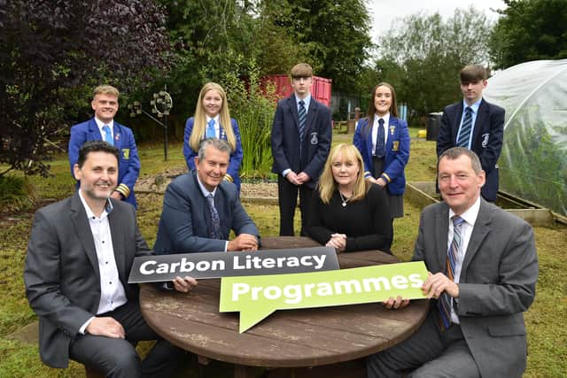 Pupils from Antrim Grammar School and St Benedict’s College, Randalstown, helped launch a new DAERA-funded Carbon Literacy project to help in the fight against climate change. (L-R) Scott Howes, Keep Northern Ireland Beautiful, Environment Minister Edwin Poots, Education Minister Michelle McIlveen and Ian Humphrey, Chief Executive of Keep Northern Ireland Beautiful