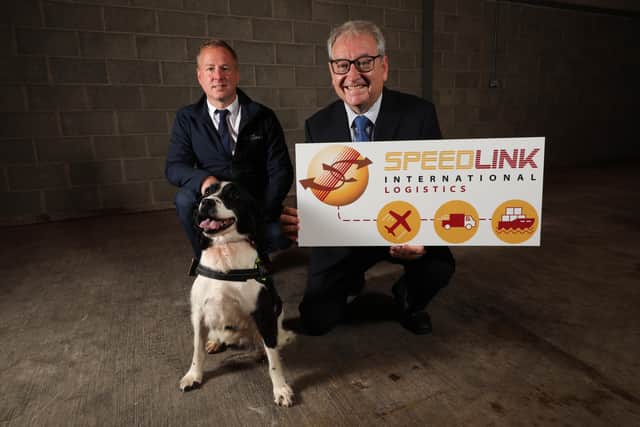 David Rogers, director at Speedlink with managing director Tony Budde and one of the dogs