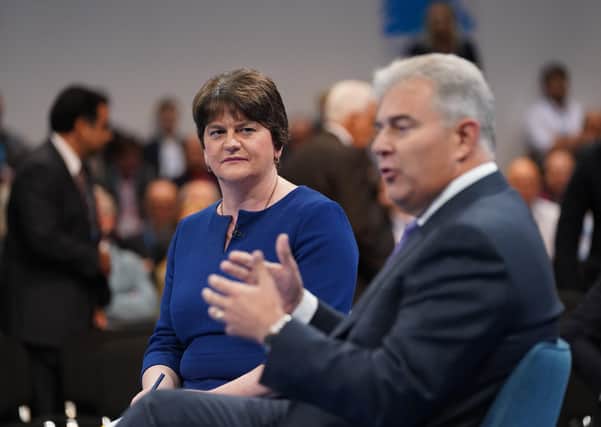 Northern Ireland Secretary Brandon Lewis and former DUP leader Arlene Foster speaking at the Conservative Party Conference in Manchester on Monday. Picture: Press Association