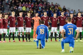 Sparta Prague's players stand while Rangers' midfielder Glen Kamara (front L) and Rangers' defender Borna Barisic take the knee prior to the start of the UEFA Europa League Group A match last week