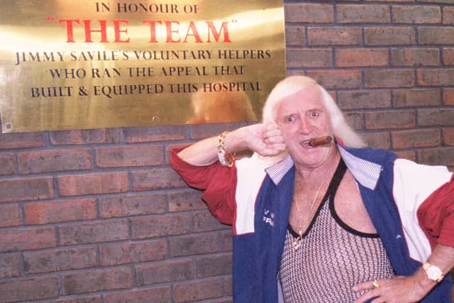 Sir Jimmy Savile at Stoke Mandeville Hospital in September 2003