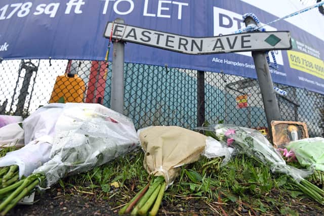 Floral tributes left on Eastern Avenue, Grays, Essex, where 39 bodies were discovered in a lorry. PA Photo. Picture date: Friday October 25, 2019. Police confirmed that the eight women and 31 men found in the vehicle on an industrial estate in Grays were all Chinese. See PA story POLICE Container. Photo credit should read: Kirsty O'Connor/PA Wire