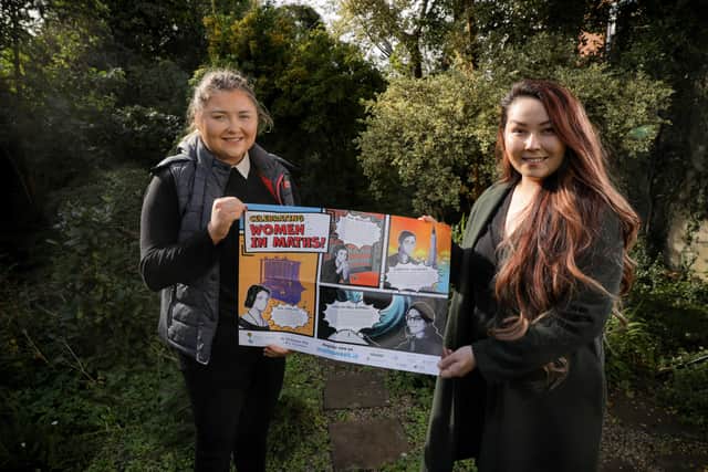 Laura McDermott and Siofra Frost with the 2021 Women in Maths poster which features Northern Ireland’s Dame Jocelyn Bell Burnell