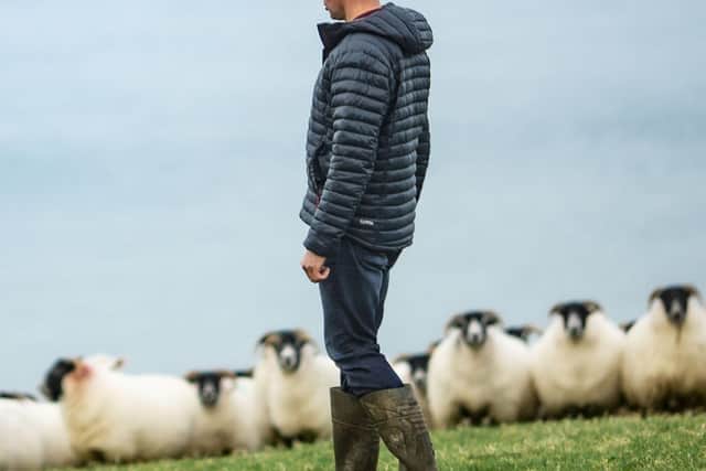 Eamonn Matthews monitoring his sheep and lambs on the Antrim hills