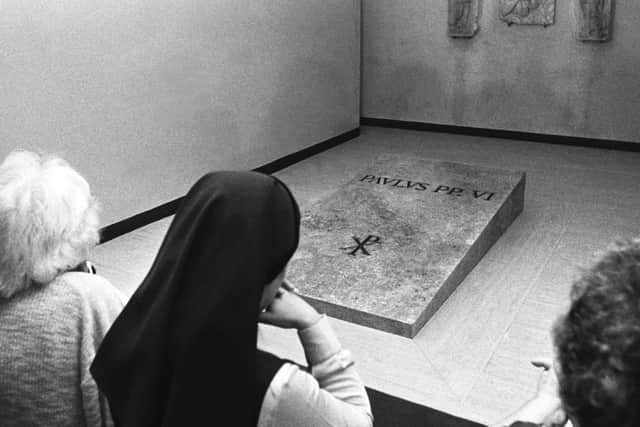 Kneeling women are seen in this August 13, 1978 file photograph as they pray in front of the tomb of the late Pontiff Pope Paul VI in the Vatican Grottos underneath St Peter's Basilica at the Vatican. Picture: AP Photo/Giulio Broglio