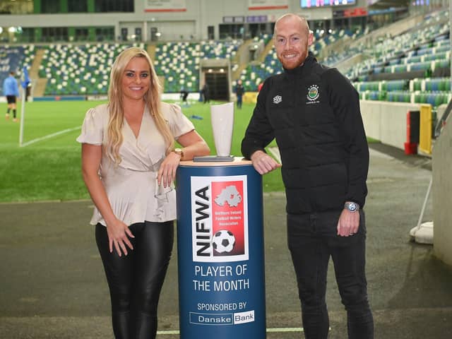 Danske Bank Premiership Player of the Month Chris Shields receives the award from Ruth Gorman