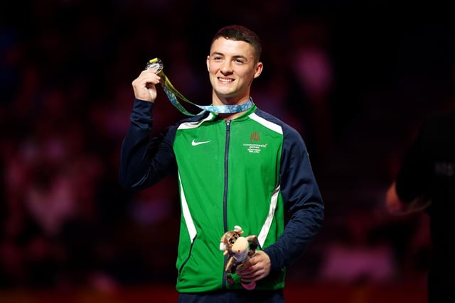 Northern Ireland's Rhys McClenaghan receives his silver medal during the ceremony for the Men's Pommel Horse Final at Arena Birmingham on day four of the 2022 Commonwealth Games