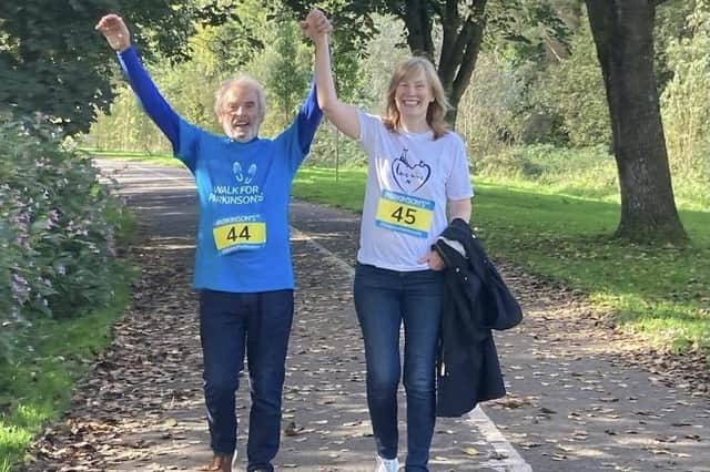 Peter Donaldson and his wife Jan crossing the finishing line at last year's Walk for Parkinson's