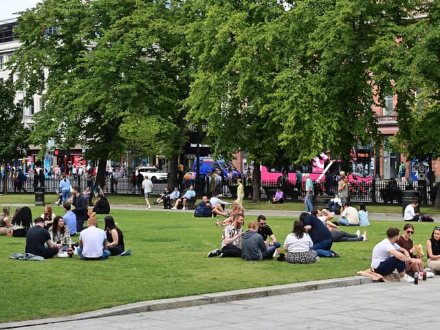 Enjoying the warm weather at Belfast City Hall on Tuesday as the hot weather is expected to continue for the week ahead.
Pic Colm Lenaghan/Pacemaker