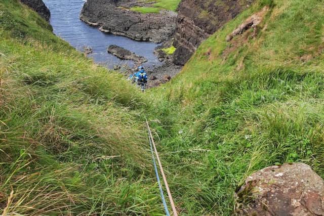 A rope rescue is carried out for the injured party near Dunluce Castle