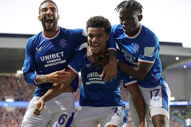 Rangers' Malik Tillman (centre) celebrates with Connor Goldson (left) and Rabbi Matondo after scoring their side's third goal of the game during the UEFA Champions League, third qualifying round, second leg match at Ibrox Stadium, Glasgow. Picture date: Tuesday August 9, 2022.