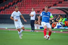 Linfield captain Jamie Mulgrew shields the ball from FC Zurich’s Marchesano
