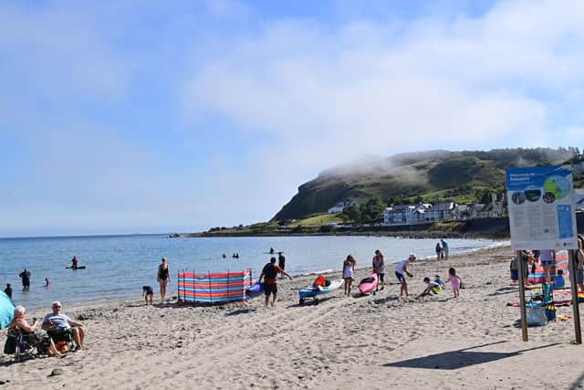 Cooling down at the beach in Ballygally, Co Antrim on Friday as the mini-heatwave continued.
Photo: Colm Lenaghan/Pacemaker