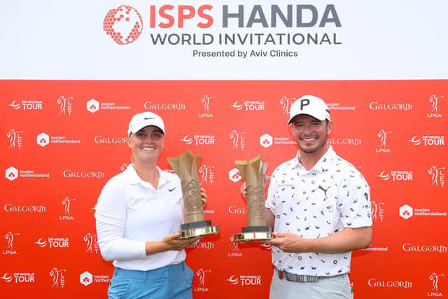 Maja Stark of Sweden and Ewen Ferguson of Scotland pose for a photograph with their trophies after winning the Women’s and Men’s tournaments