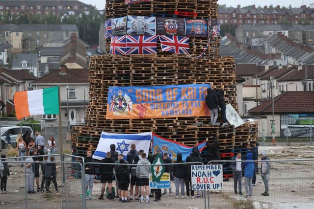 People view a bonfire prior to it being lit to mark the Catholic Feast of the Assumption in the Bogside area of Londonderry, Northern Ireland. Picture date: Monday August 15, 2022.