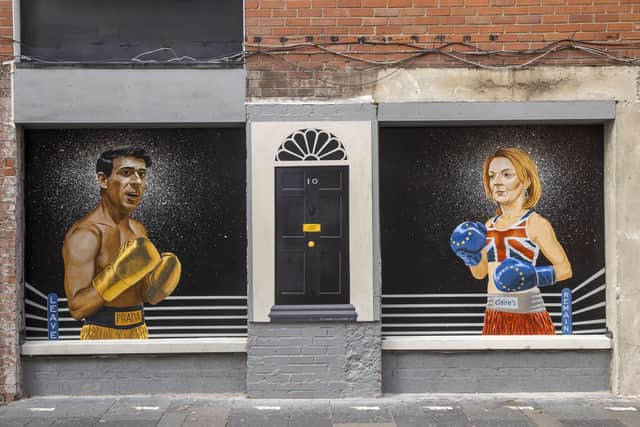 A mural depicting Tory leadership contenders Rishi Sunak and Liz Truss as boxers appeared in Hill Street in Belfast city centre yesterday. The pair will debate in Northern Ireland today. Photo: Liam McBurney/PA Wire