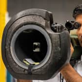 Rishi Sunak looks at a NLAW anti tank launcher, supplied to Ukraine, during a campaign visit to Thales Defence System plant in Belfast yesterday. He says the protocol did not allow him to extend an energy-saving VAT cut to NI