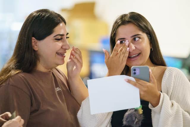 Naz Capar (right) and her sister Sara react after receiving their A-level results at Oasis Academy Hadley, Enfield, north London