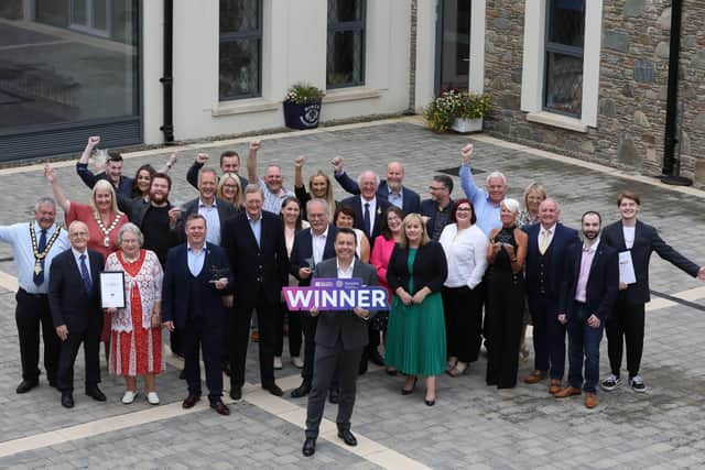 The joint winners of High Street of the Year, Coleraine and Newtownards, join Chief Executive of Retail NI, Glyn Roberts and Parliamentary Under-Secretary of State for Northern Ireland, Lord Caine at the High Street Hero Awards