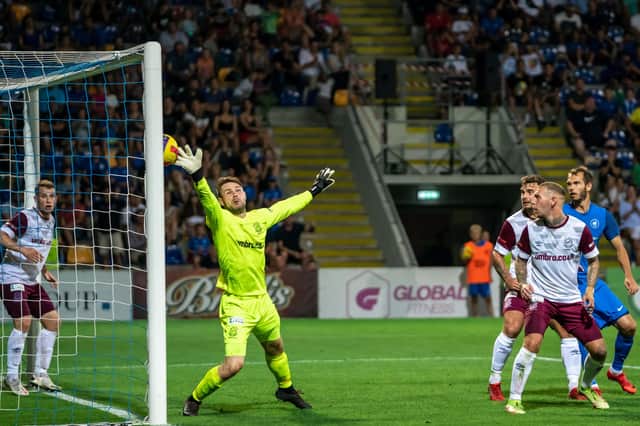 Linfield goalkeeper Chris Johns is unable to keep out a late RFS Riga goal in the 2-2 draw across the Europa Conference League first-leg clash. Pic by Pacemaker.