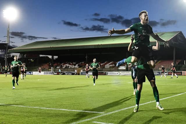 Aidan Wilson celebrates scoring the closing goal for Glentoran in victory over Crusaders under the Oval floodlights. Pic by Pacemaker