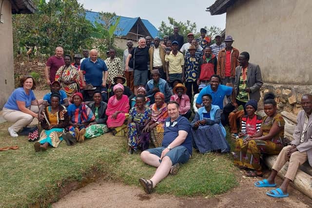 SEFF representatives with a cell group made up of repentant perpetrators of the genocide and Tutsi survivors.