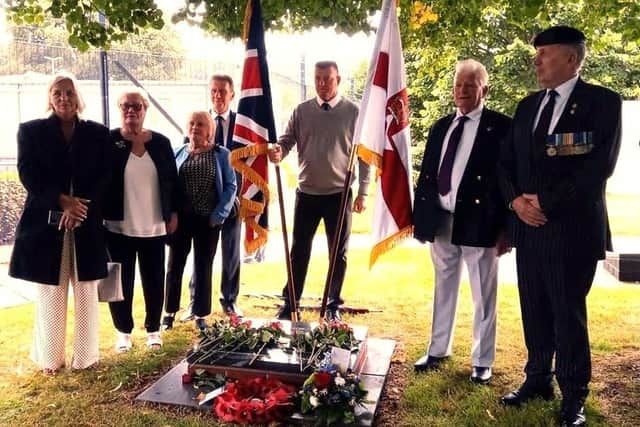 Unveiling of a memorial stone to veteran Denis Hutchings at Palace Barracks on 20 August 2022. From left; Denis' daughter Dawn Hutchings, Helen (partner of Denis's brother Rex), local NI couple who are friends of the family; Denis' son, John; Denis' brother Rex, and Paul Young, spokesman for NI Veterans for Justice Group.