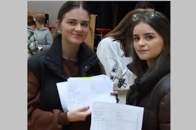 Twins Zara and Olivia Kennedy at the Girls' Model School in Belfast on Thursday August 18 2022 getting their AS Level results. They studied different subjects yet by coincidence they both got the same grades, two As and a B
