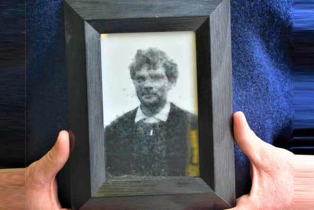 Charlie Agnew , Nephew of John Pat Cunningham holds a photo of his uncle at a press conference in Belfast in 2013 after his family received an apology from the government. Mr Cunningham who was a vulnerable man was shot in a field near his home in Benburb, Co Tyrone in June 1974. The apology followed a report from the Historical Enquiries Team (HET), which found that Mr Cunningham's death was "an absolute tragedy that should not have happened". Pic Colm Lenaghan/Pacemaker
