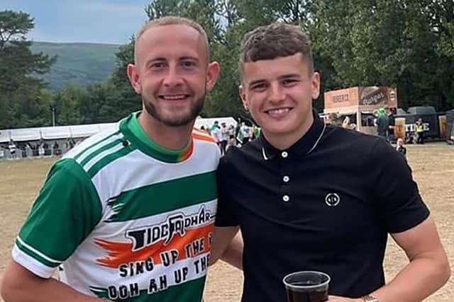 Larne FC player John Herron (left) wearing a Pro IRA T-shirt on social media with former team mate Ronan Hale at the west Belfast Feile festival