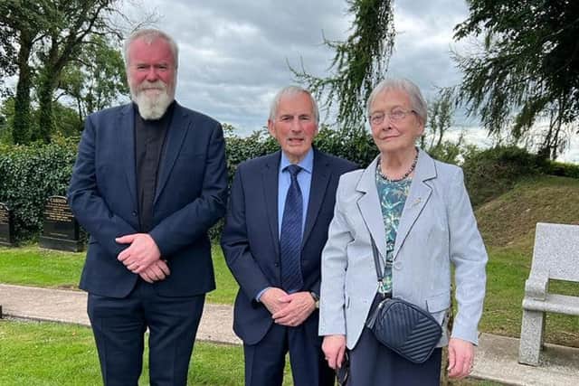 Rev Charles Eames, George Eames and Mae Eames during a memorial service on Sunday at Rossorry Parish Church in Co Fermanagh for IRA bomb victims Alfred Johnston and James Eames