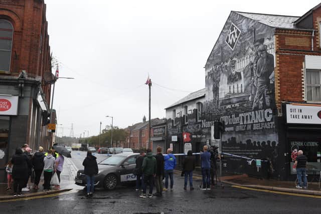 Local residents stand at a cordon on the Lower Newtownards Road as Army Technical Officers (ATO) on Dee Street, Belfast, use a robot to check vehicles during security alert following the discovery of a suspicious object. Picture date: Monday August 22, 2022.