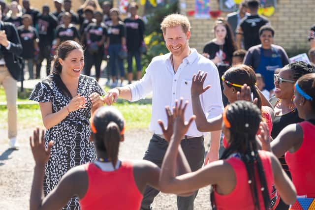 Duke and Duchess of Sussex meeting a group of dancers at the Nyanga Township in Cape Town, South Africa. Meghan recounted the experience on her long-awaited Archetypes podcast, released on Spotify on Tuesday, in a conversation with her close friend, tennis great Serena Williams