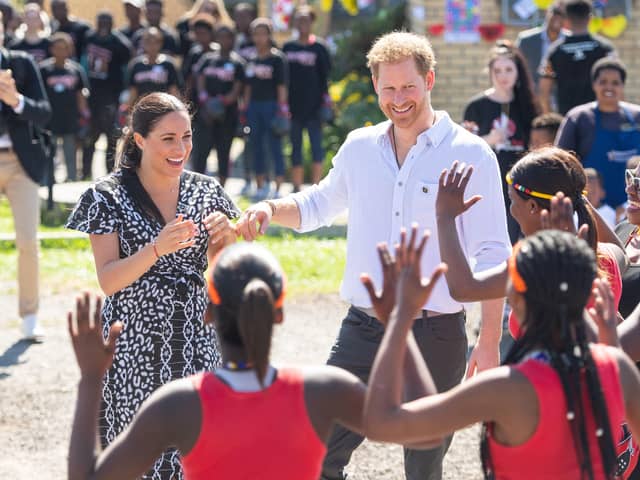 Duke and Duchess of Sussex meeting a group of dancers at the Nyanga Township in Cape Town, South Africa. Meghan recounted the experience on her long-awaited Archetypes podcast, released on Spotify on Tuesday, in a conversation with her close friend, tennis great Serena Williams
