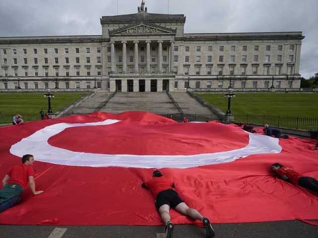 Irish language campaigners protesting outside Stormont back in May