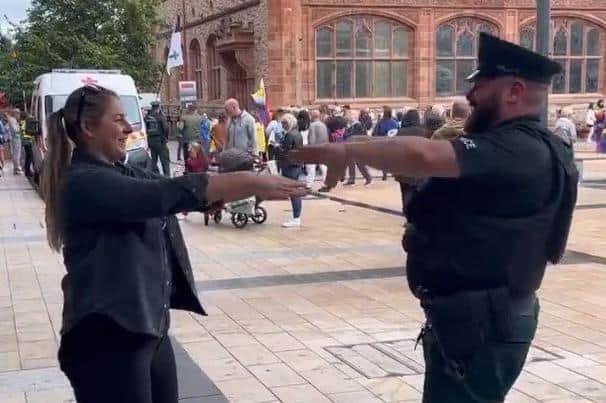 A PSNI officer has sparked a fierce debate on social media by dancing with a member of the public at the Derry Pride parade 2022.