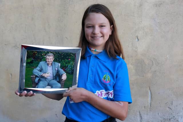 Hannah Noonan with a picture of her late grandfather Tony Devlin from Ballymena who had pulmonary fibrosis