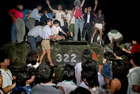 Civilians hold rocks as they stand on a government-armoured vehicle near Changan Boulevard in Beijing on June 4, 1989. Over seven weeks in 1989, student-led pro-democracy protests centred on Tiananmen Square became China’s greatest political upheaval since the end of the Cultural Revolution