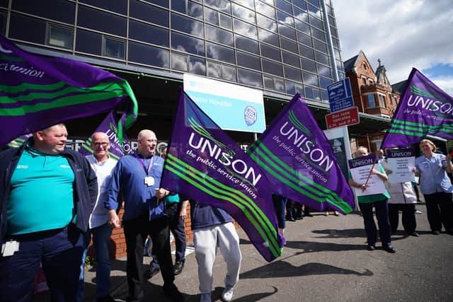 Unison members take part in a protest outside the Mater Hospital in Belfast