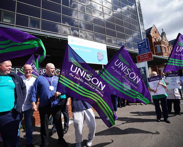 Unison members take part in a protest outside the Mater Hospital in Belfast