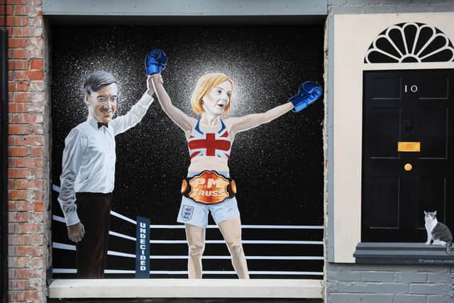 The mural by artist Ciaran Gallagher depicting Liz Truss being declared a winner by Jacob Rees Mogg after beating Rishi Sunak