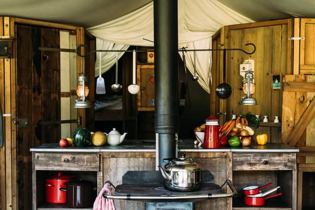 The kitchen and lounge of the traditional-farmhouse chalet tent at the Feather Down Cwmberach Uchaf Farm