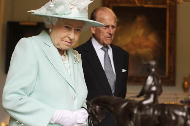 BELFAST, NORTHERN IRELAND - JUNE 25:  Queen Elizabeth II and Prince Philip, Duke of Edinburgh visit Hillsborough Castle during filming of Antiques Roadshow, on the third and final day of the Queen's visit to Northern Ireland, on June 25, in Belfast, Northern Ireland. (Photo by Brian Lawless - WPA Pool/Getty Images)