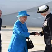 The Queen and Prince Philip, left, are greeted in 2014 by a previous Lord Lieutenant of Belfast, Mary Peters