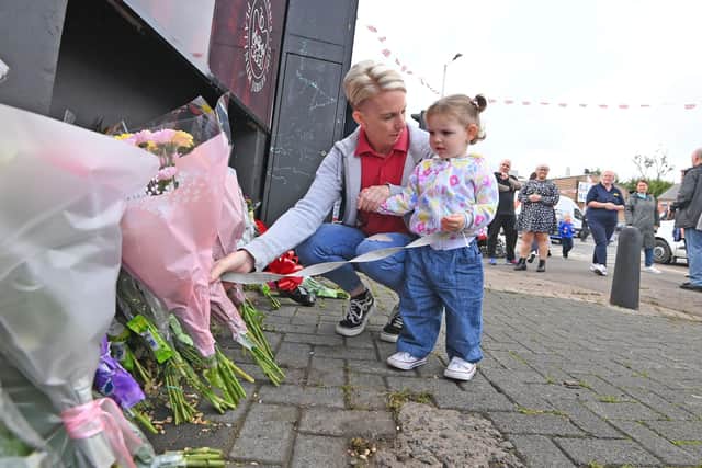 Mourners laid flowers at the Queen Elizabeth mural on Belfast's Shankill Road. Photo: Stephen Hamilton/Presseye