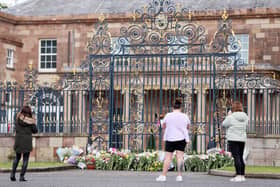 Laying floral tributes to Queen Elizabeth at Hillsborough Castle