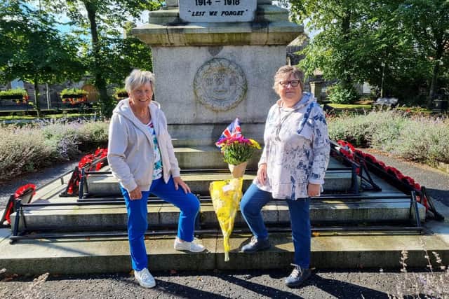 Jeanette Warke and her friend Annie Shields with a floral tribute to the Queen