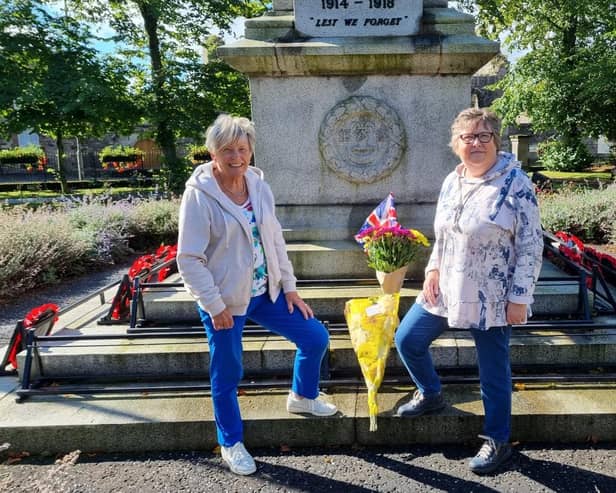 Jeanette Warke and her friend Annie Shields with a floral tribute to the Queen