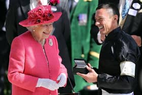 Queen Elizabeth II pictured chatting to Frankie Dettori at the winner's presentation after he won The Gold Cup on day 3 of Royal Ascot at Ascot Racecourse on June 21, 2018