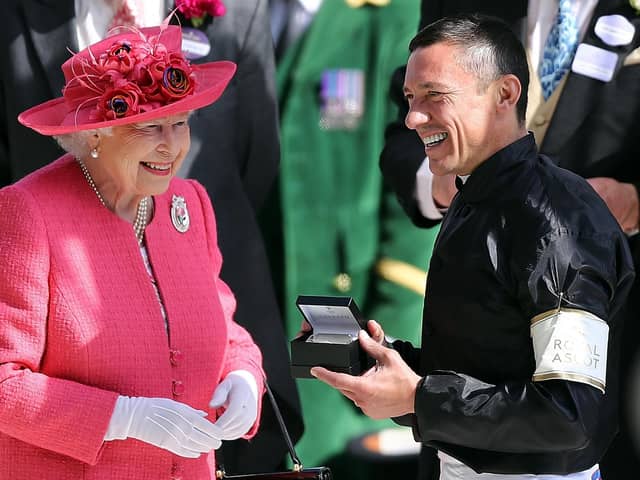 Queen Elizabeth II pictured chatting to Frankie Dettori at the winner's presentation after he won The Gold Cup on day 3 of Royal Ascot at Ascot Racecourse on June 21, 2018